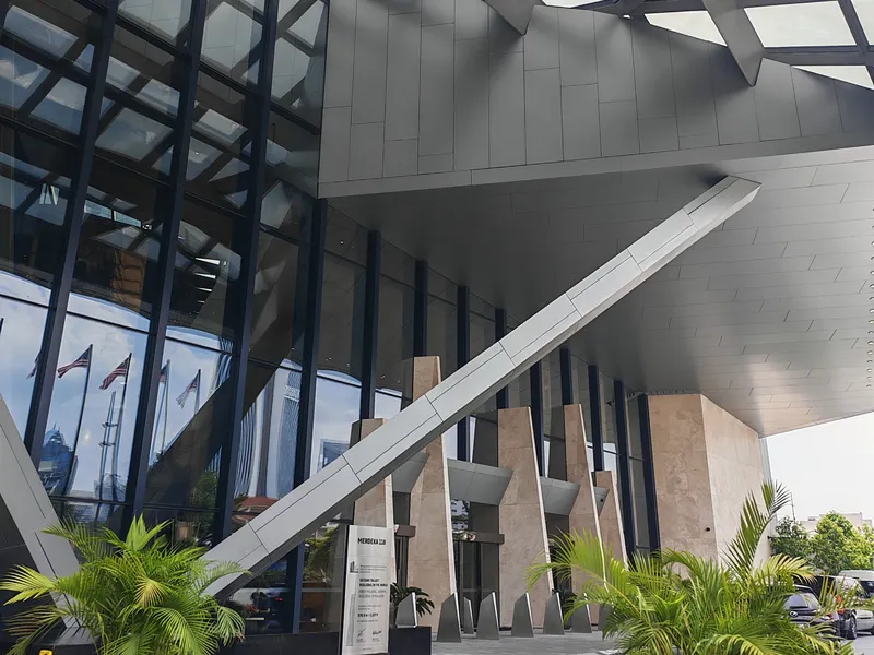 Drop-off porch with angled steel columns
