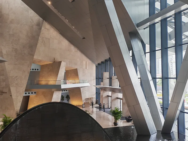 Lobby water feature beneath the faceted ceiling